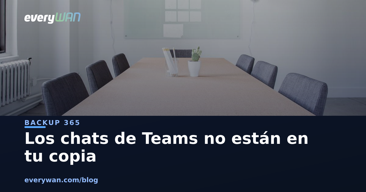 An empty meeting room with a long table, chairs and a wiped glass whiteboard at the back