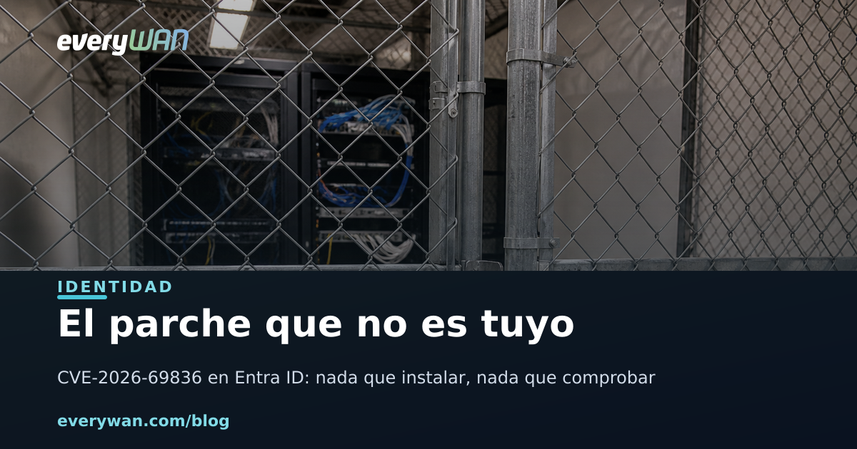 Padlocked wire-mesh cage in a shared datacenter hall, seen from outside