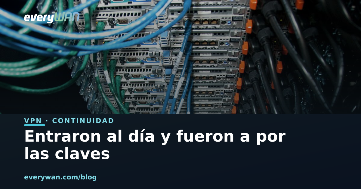 Parte trasera de un armario con servidores y latiguillos de red azules y verdes